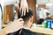 Male Expert`s Hands Using Scissors To Cut Client`s Hair