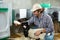 Male farm worker feeding baby sheep