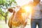 Male farmer checking on his herd and rubbing a healthy organic cow on a farm