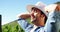 Male farmer relaxing with hands behind back at a vineyard