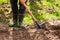 Male Farmer In Rubber Boots With Shovel And Potatoes In Ground I