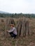 Male farmer Sitting in the midst of tapioca limb that cut the stack together in the farm