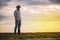 Male Farmer Standing on Fertile Agricultural Farm Land Soil