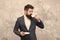 Male fashion model. Mature businessman. elegant man with beard drink coffee. Brutal bearded hipster in formal suit