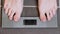 Male feet on glass scales, men`s diet, body weight