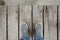 Male Feets With Shoes Standing On Wooden Pier In front Of The Sea