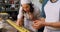 Male and female baker putting ingredients on pasta dough 4k