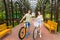 Male and female with bikes in archway