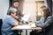 Male and female business groups sitting in the office