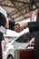 Male and female businessmen shaking hands