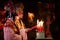 Male and female Chinese opera actors Light a candle to pray homage to the gods to enhance the prosperity for yourself on the