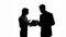 Male and female colleague silhouettes arguing over business documents at office
