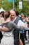 Male and female couple demonstrate a sensual tango dance holding each other closely