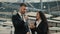 Male And Female Coworkers Talking Standing In Spacious Office