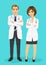 Male and female doctors standing with arms folded