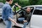 male and female drivers quarreling on road after