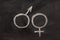 Male and female gender symbols on blackboard