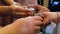 Male and female hands clink wineglasses after toast. Closeup