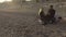 Male and female having picnic on beach in Nice, guy feeding girl with strawberry