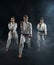 Male and female karate fighters in white kimono