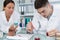 Male and female medical or scientific researchers in laboratory