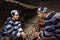 Male and female prisoners wearing prison uniform sitting and loo