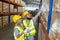 Male and Female professional worker wearing safety uniform using tablet inspect goods on shelves in warehouse. supervisor worker