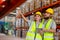 Male and Female professional worker wearing safety uniform using tablet inspect goods on shelves in warehouse. supervisor worker