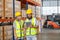 Male and Female professional worker wearing safety uniform using tablet inspect goods on shelves in warehouse. supervisor worker