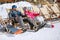 Male and female skiers enjoy in sun loungers