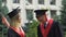 Male and female students graduating from university, happy friends talking