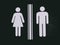 Male and female toilet symbols on wall