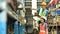 Male and female workers wearing hardhats and reflective jackets checking inventory boxes with barcode scanner in