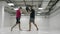 Male fighter boxer with coaches practicing the technique of blows and dodging blows in slow motion. Preparation for the