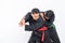 Male fighters in black pencak silat uniforms fight by holding and locking their opponent`s hands with copyspace