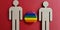 Male figures with LGBT flag badge closeup