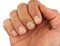 Male fingers with dirt under the nails, closeup macro, isolated