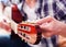 Male fingers tuning acoustic guitar. Close-up.