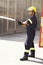 Male firefighter, spray water and emergency worker with helmet, uniform and brave to stop inferno. Fireman, fire hose