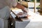 Male fisherman filets and processes a freshly caught halibut