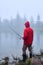 Male fishing on foggy weather