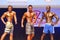 Male fitness models show their physique in swimsuit om stage