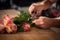 Male florist preparing flower bouquet