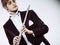 Male flutist wearing tailcoat holds flute