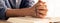 Male folded hand prayed on holy bible book. Blurring background Burgeoning.