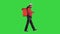 Male food courier walking looking at his phone and looking for an address on a Green Screen, Chroma Key.