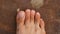 Male Foot with second toe longer than a big toe. Mortons`s toe, Greek foot or Royal toe or Aboriginal feet.