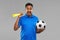 Male football fan with soccer ball and vuvuzela