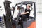 Male Fork Lift Truck Driver Working In Factory