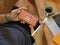 Male freelancer using mock up horizontal smartphone screen at worktable